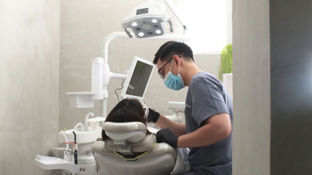 Dentist discussing holistic cosmetic dental care with a patient in Alabang at The Dental Oracle