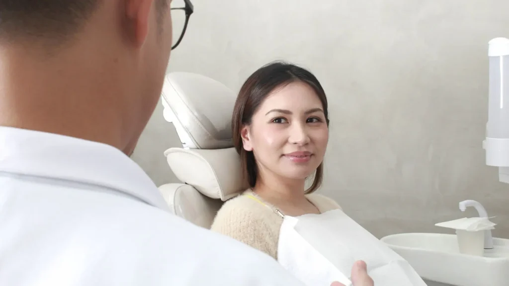 Dentist discussing holistic cosmetic dental care with a patient in Alabang at The Dental Oracle